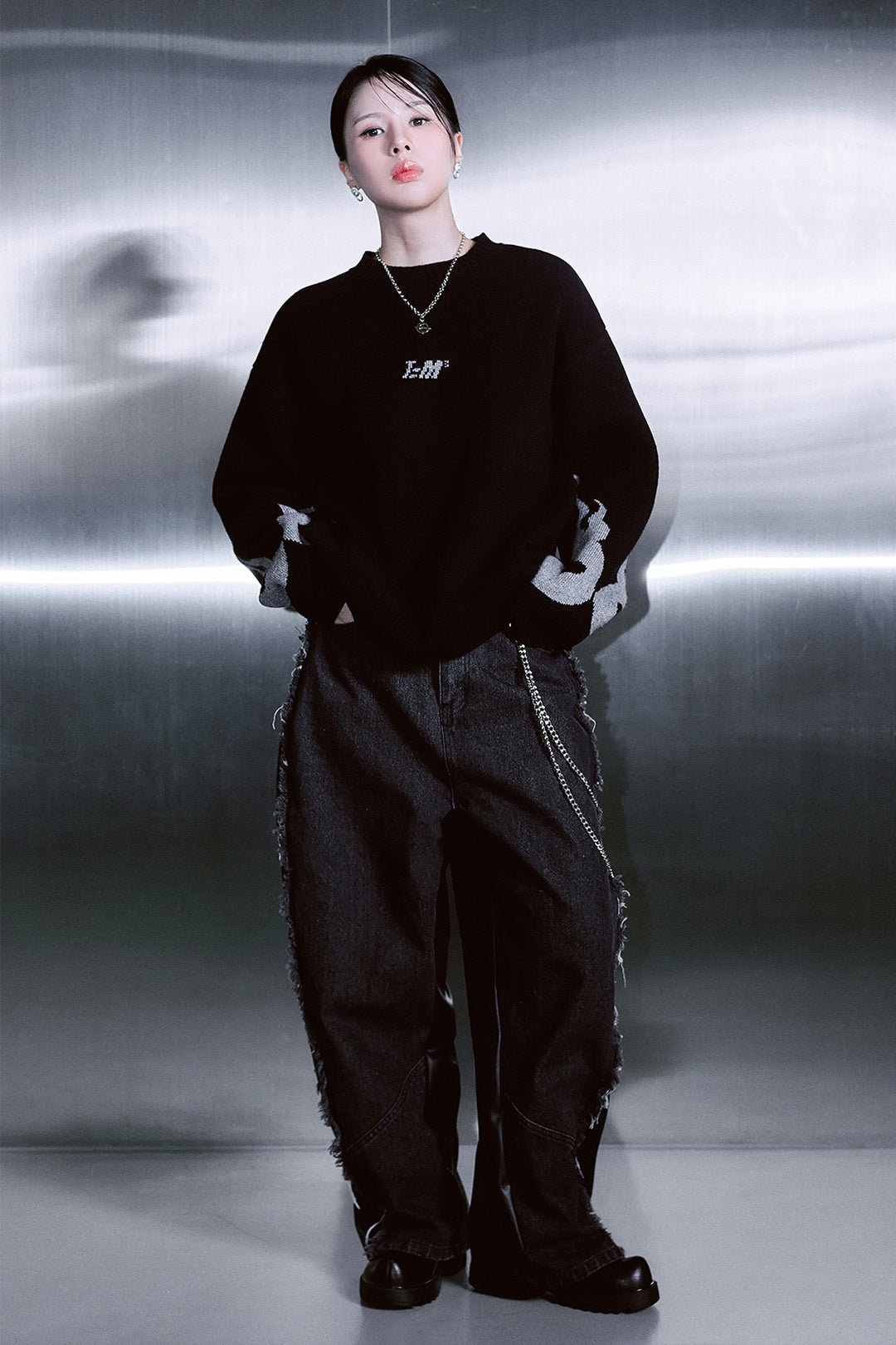 Black wide denim and leather unisex pants by TM3 with flame design and unbalanced style, featuring a modern, edgy look.