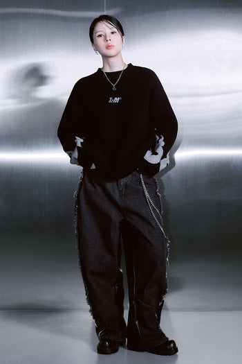 Black wide denim and leather unisex pants by TM3 with flame design and unbalanced style, featuring a modern, edgy look.