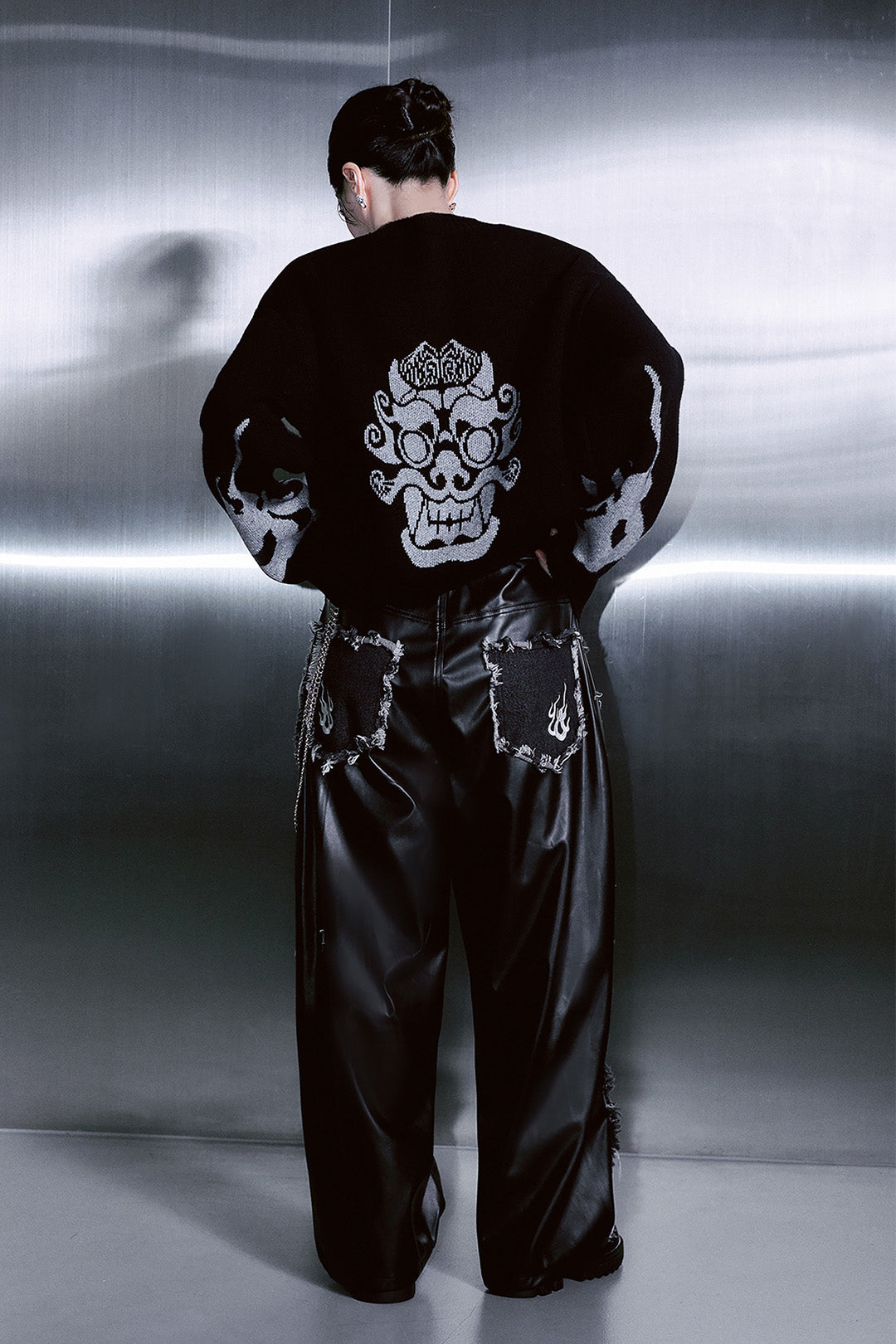 Unisex black wide denim leather pants by TM3 with flame design and unbalanced style, featuring a relaxed fit and leather accents.