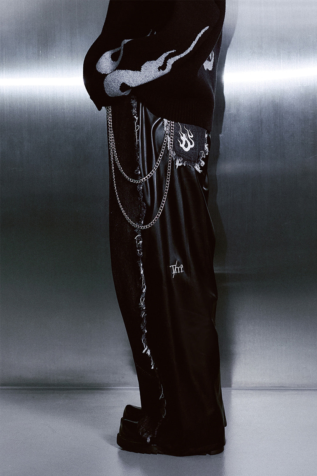 TM3 Dokkaebi Flame black denim leather unisex wide-leg pants with a bold flame design and unbalanced fit.