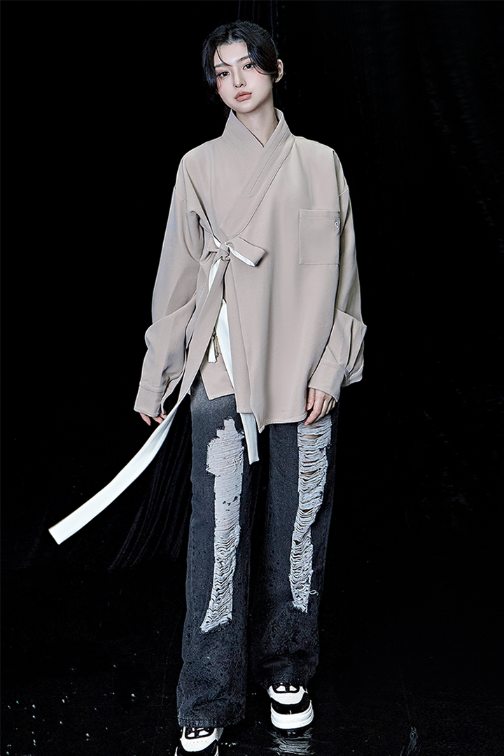 Beige oversized TM3 shirt with long sleeves and a relaxed fit, displayed flat on a plain background.