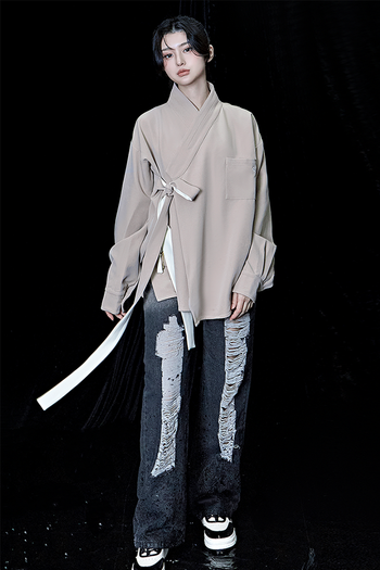 Beige oversized TM3 shirt with long sleeves and a relaxed fit, displayed flat on a plain background.