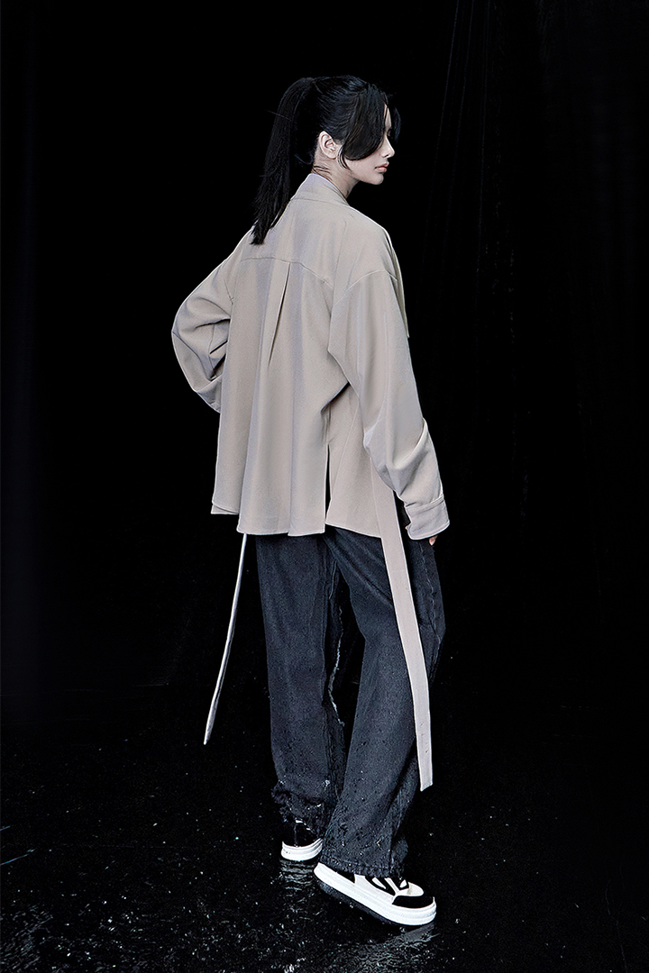 Beige oversized shirt by TM3, featuring a relaxed fit with long sleeves and a classic collar, displayed on a neutral background.