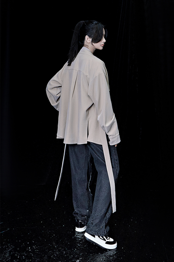 Beige oversized shirt by TM3, featuring a relaxed fit with long sleeves and a classic collar, displayed on a neutral background.