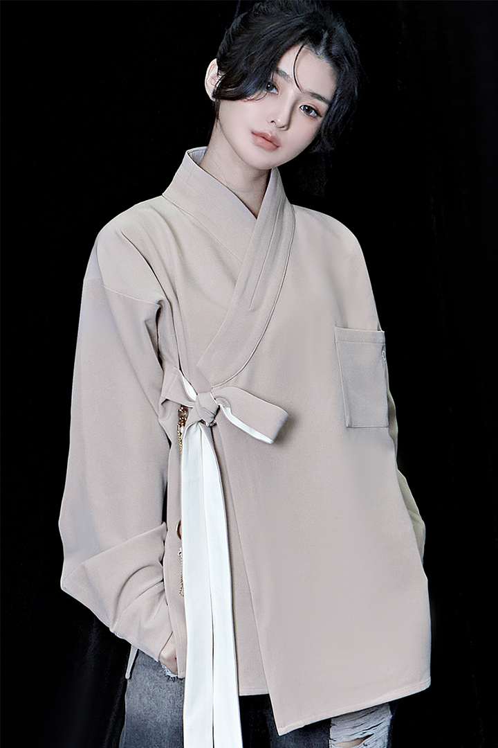 Beige oversized TM3 shirt featuring a relaxed fit, long sleeves, and a classic collar, ideal for casual or stylish wear.