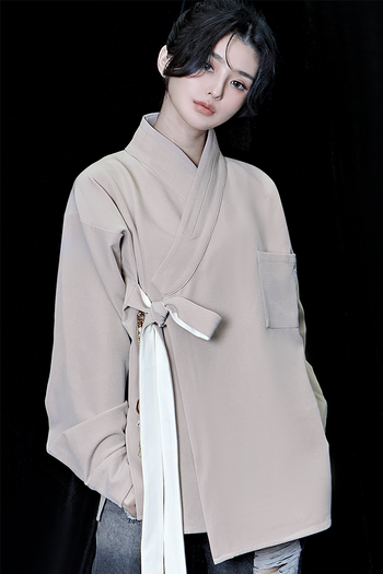 Beige oversized TM3 shirt featuring a relaxed fit, long sleeves, and a classic collar, ideal for casual or stylish wear.