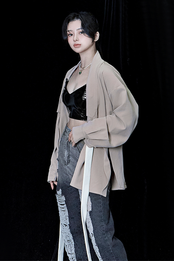 Beige oversized TM3 shirt with a relaxed fit, long sleeves, and a classic collar, displayed on a hanger.