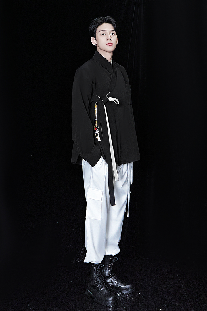 Black oversized shirt from TM3, featuring a relaxed fit and casual style, displayed flat on a white background.