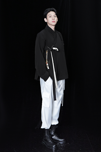 Black oversized shirt from TM3, featuring a relaxed fit and casual style, displayed flat on a white background.