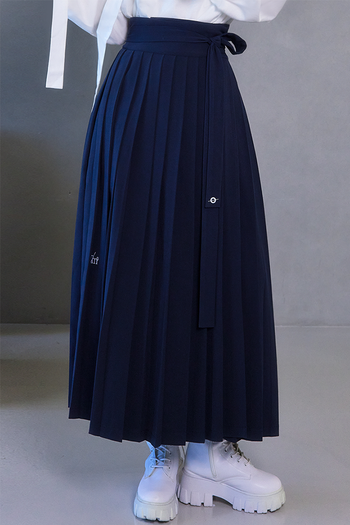 Deep Sea Navy pleated skirt by TM3, featuring a stylish navy color and elegant pleats, shown on a model.