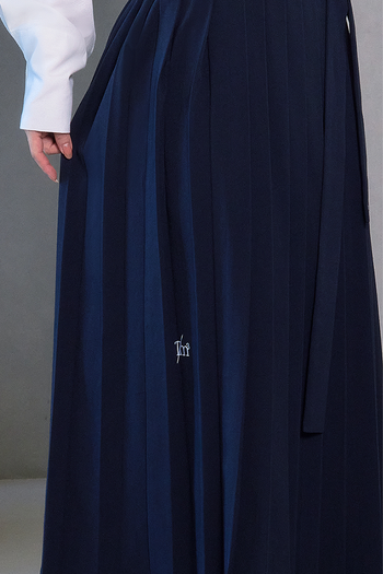 Deep Sea Navy Pleated Skirt from TM3, featuring a stylish navy pleated design, displayed on a plain background.