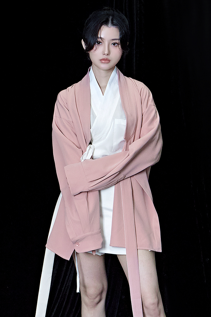 Pink oversized TM3 shirt with relaxed fit, featuring long sleeves and a casual style, displayed on a plain background.