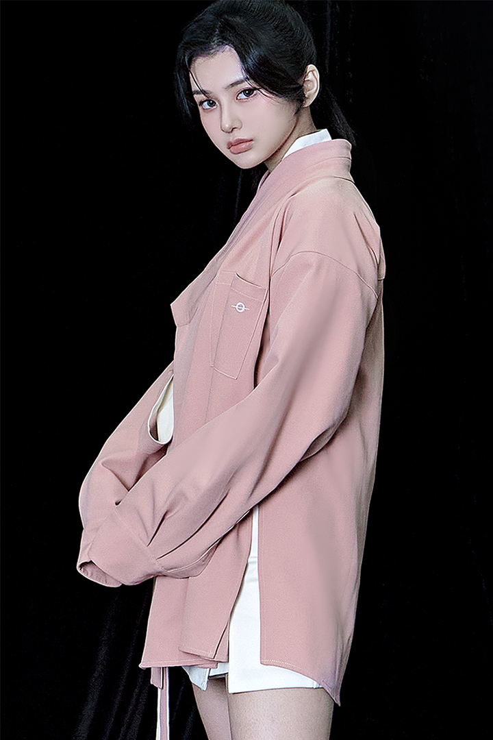 Pink oversized shirt by TM3, displayed flat with long sleeves and relaxed fit, perfect for casual style.
