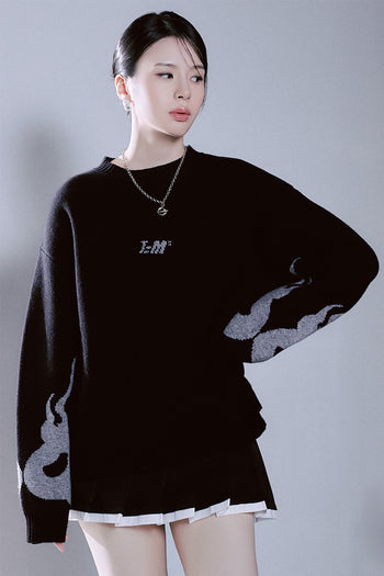 Black TM3 Korean Dokkaebi face merino wool knit sweater featuring traditional design and detailed embroidery.