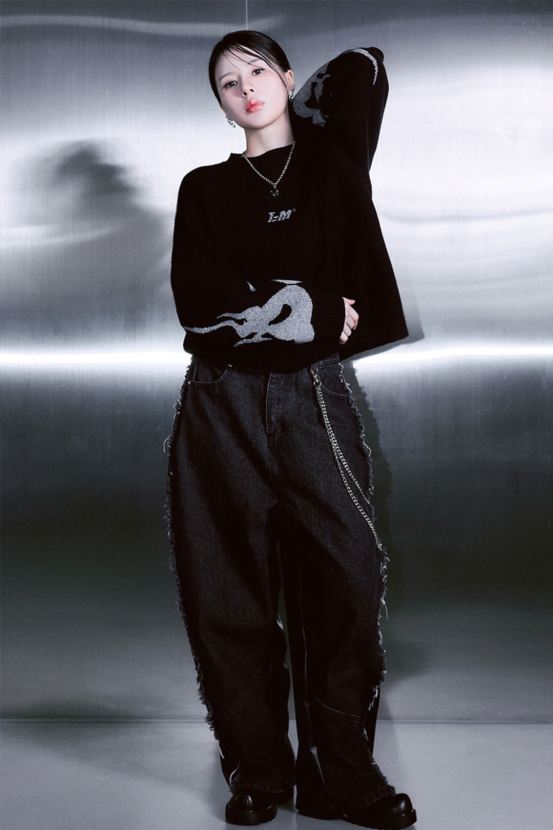 Black TM3 Korean Dokkaebi face Merino wool knit sweater featuring traditional Korean design and a cozy, textured knit pattern.