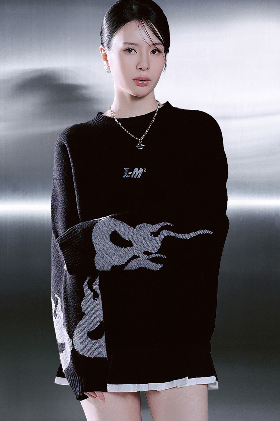 Black TM3 sweater featuring a traditional Korean Dokkaebi face design knitted in Merino wool.