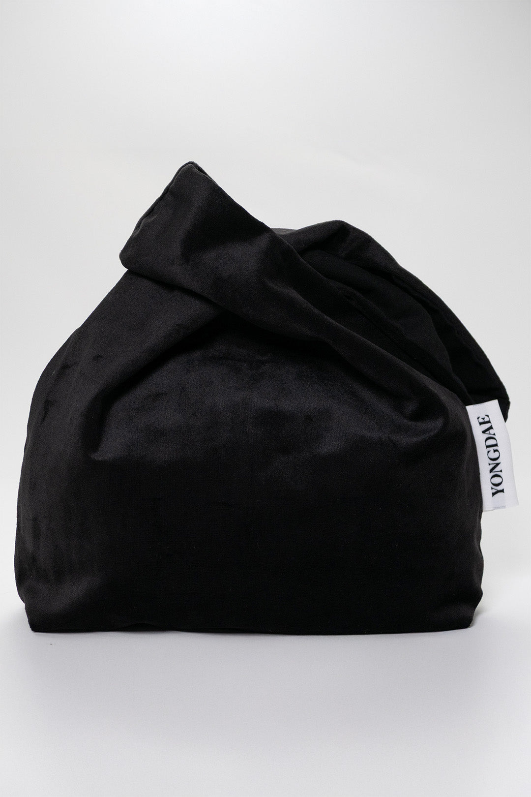 Black YONGDAE K-Beauty fashion bag with sleek design, featuring the brand logo and stylish appearance for everyday use.